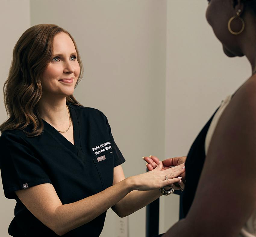 physician touching patient's hand