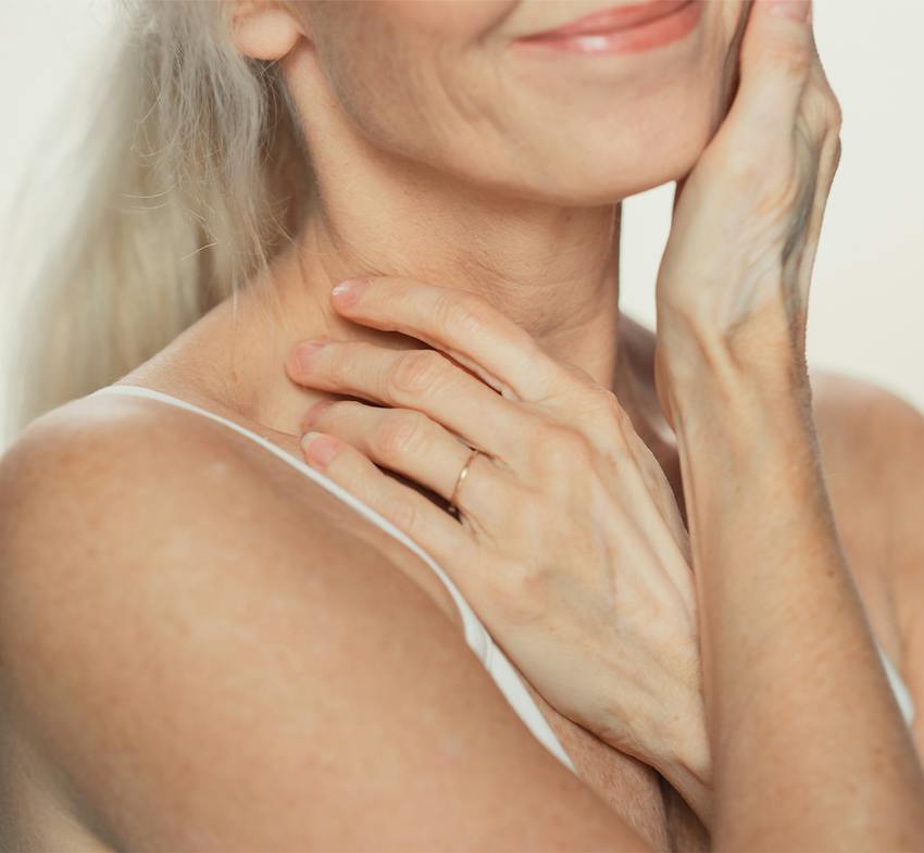Woman touching her neck