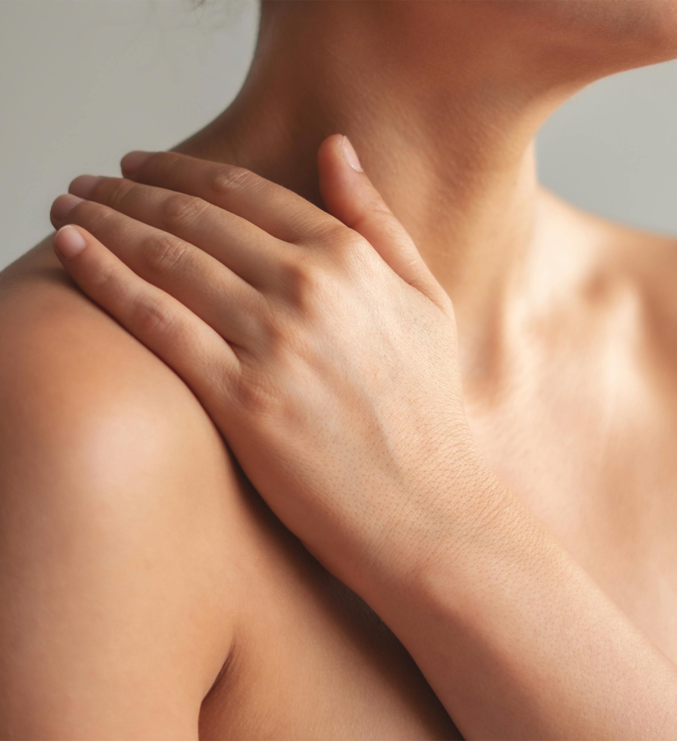 A person holding their shoulder