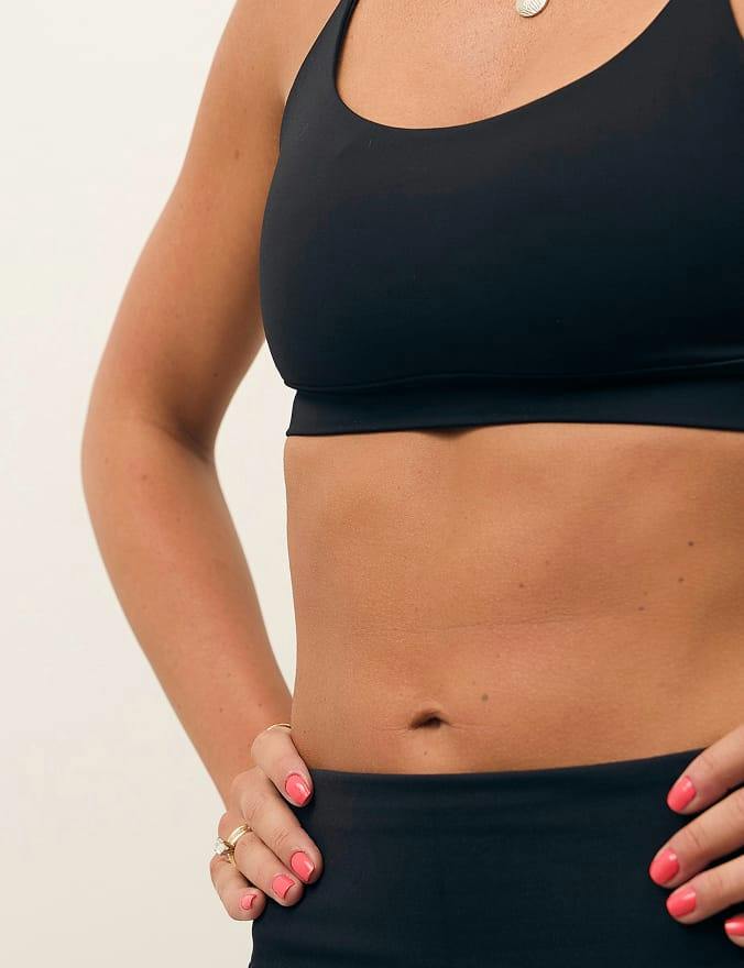Woman's torso in black activewear