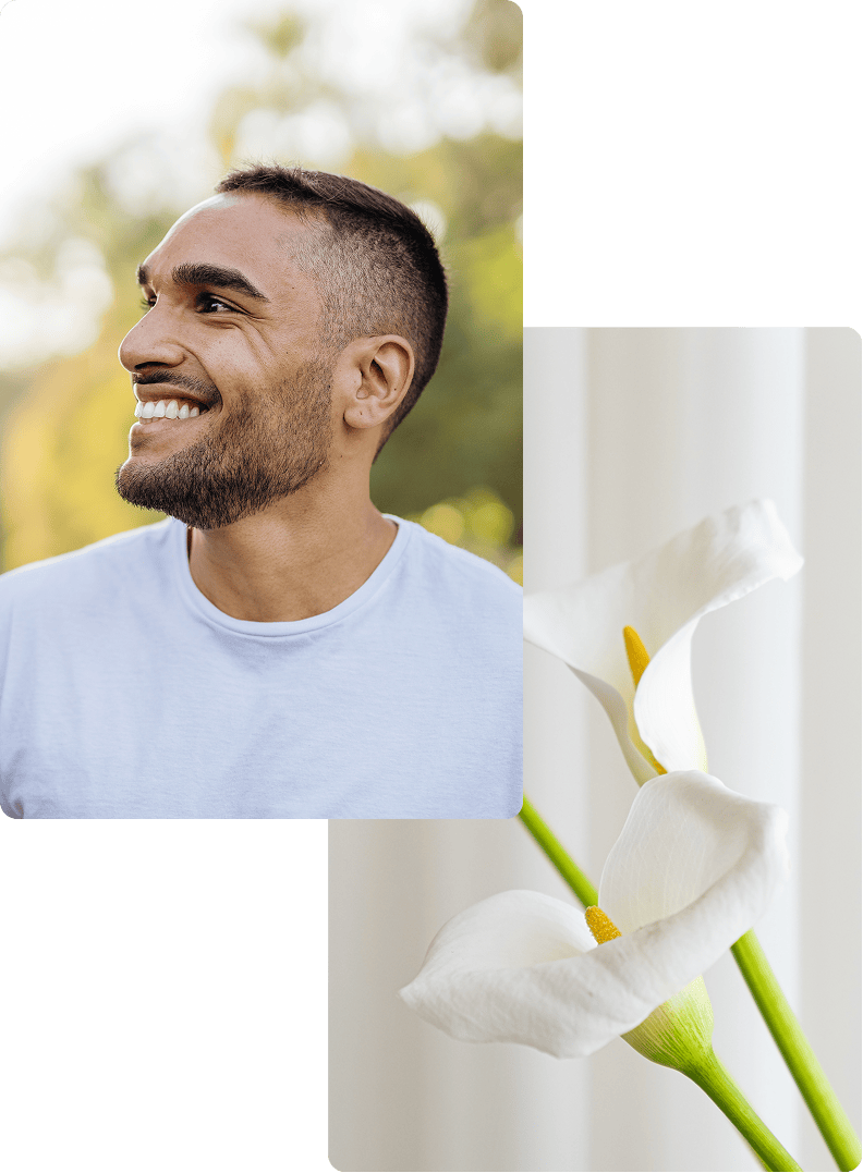 Man smiling | White flowers