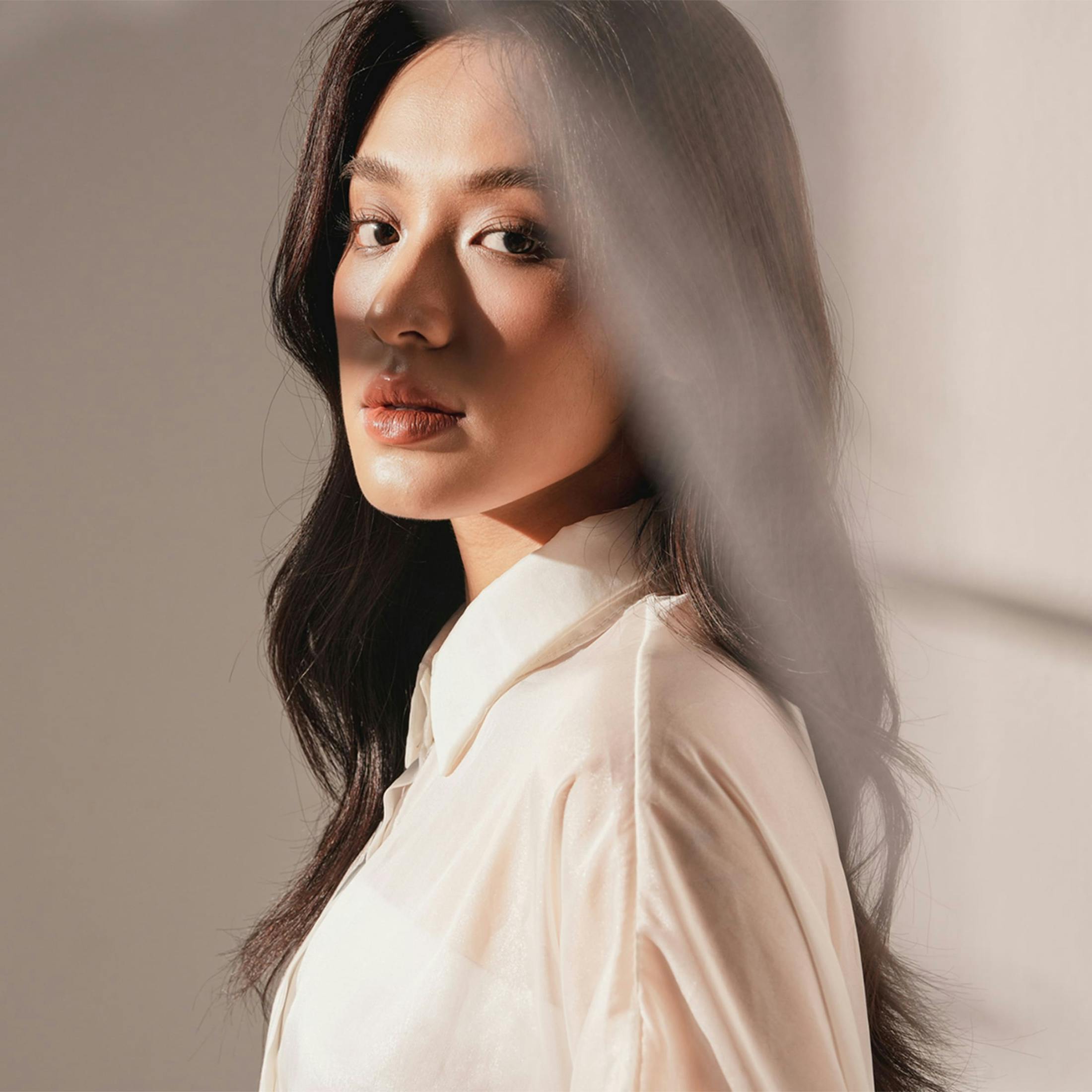 Woman looking over her shoulder