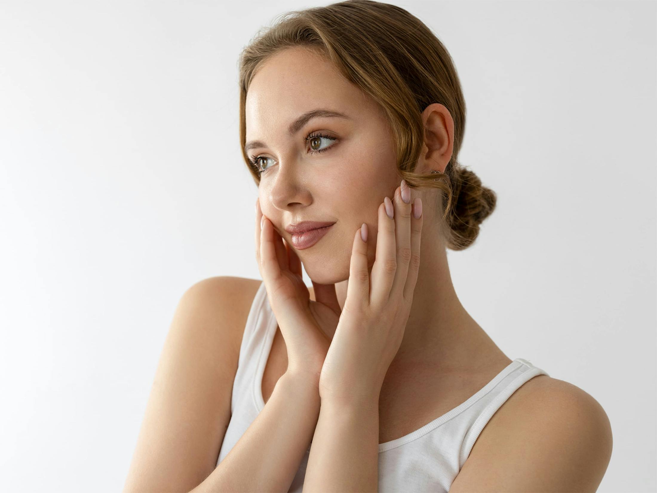 Woman touching her cheeks