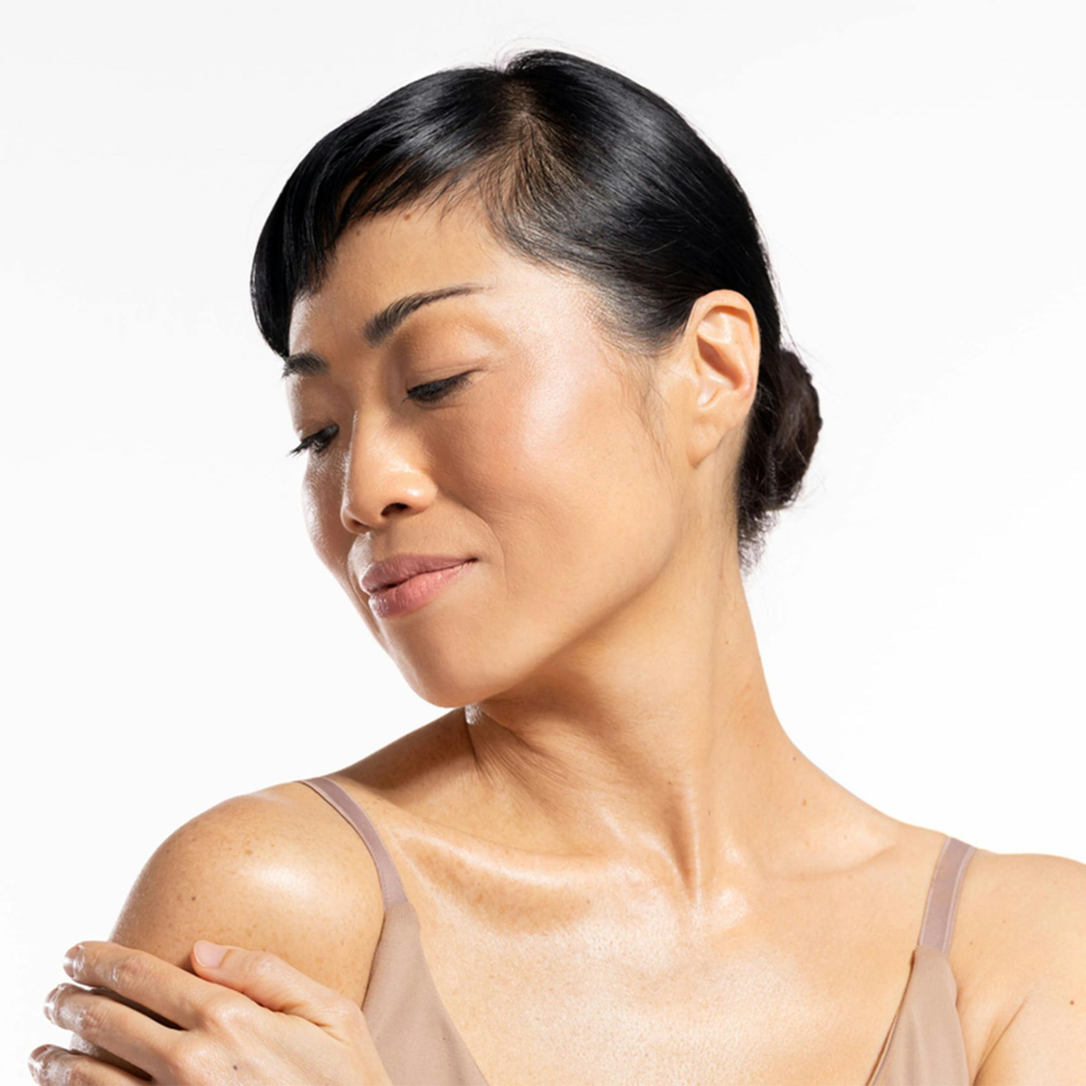 Woman touching her shoulder