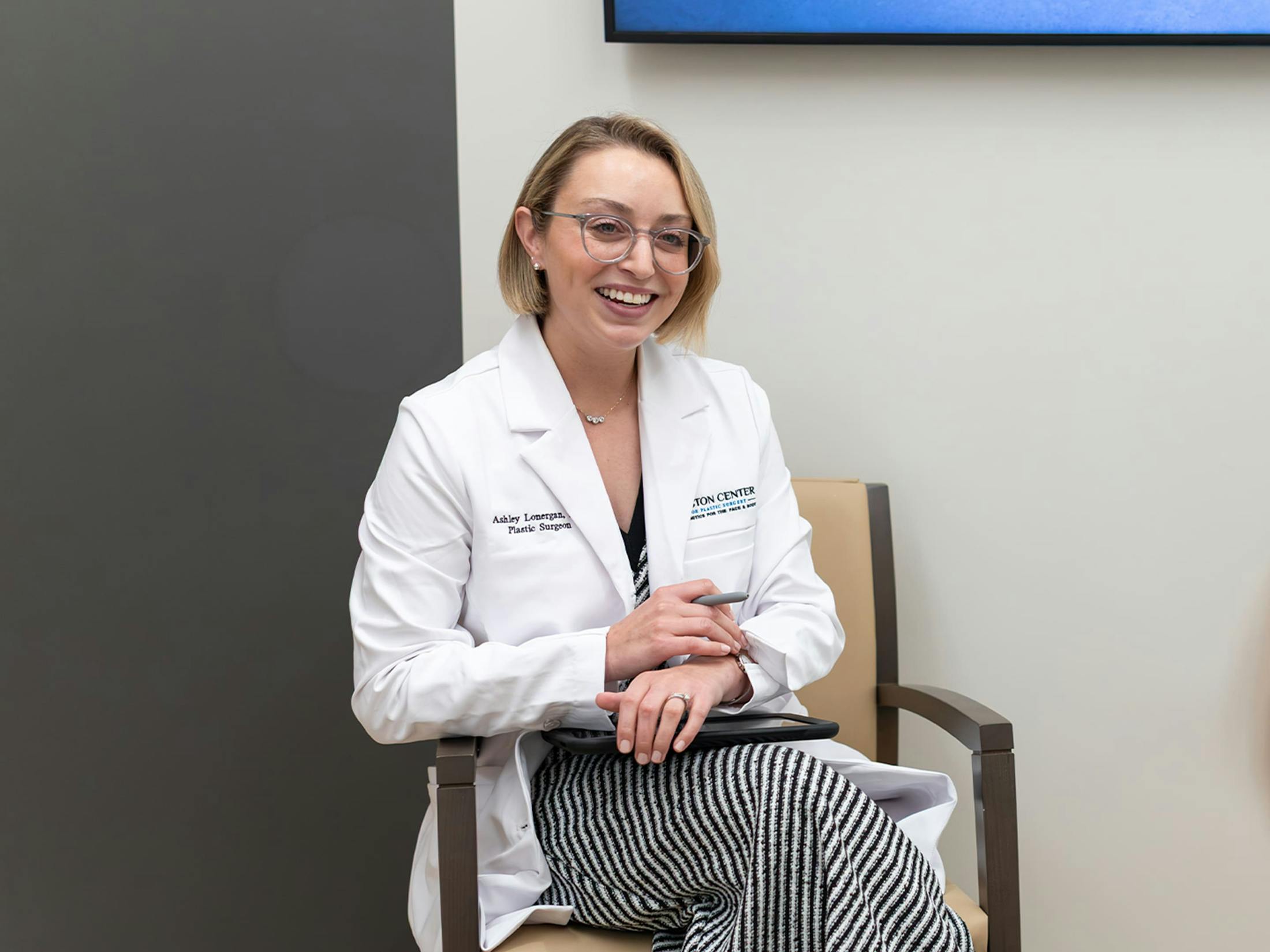 Doctor smiling while sitting