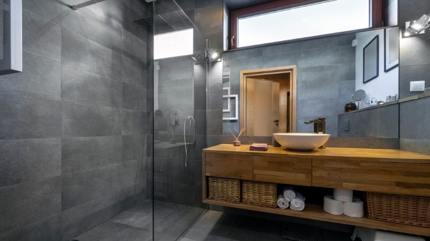 Stylish and modern bathroom with bathroom furniture and shower cabin