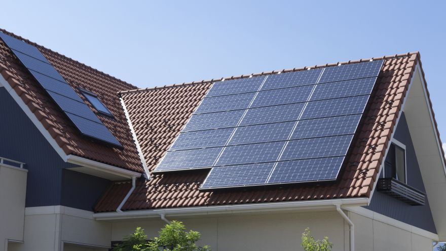 Photovoltaic panels mounted on the roof of a residential house