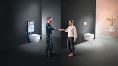 woman-and-man-in-the-bathroom-after-installation-of-the-wall-frame