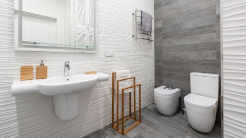Modern gray bathroom with a rimless toilet