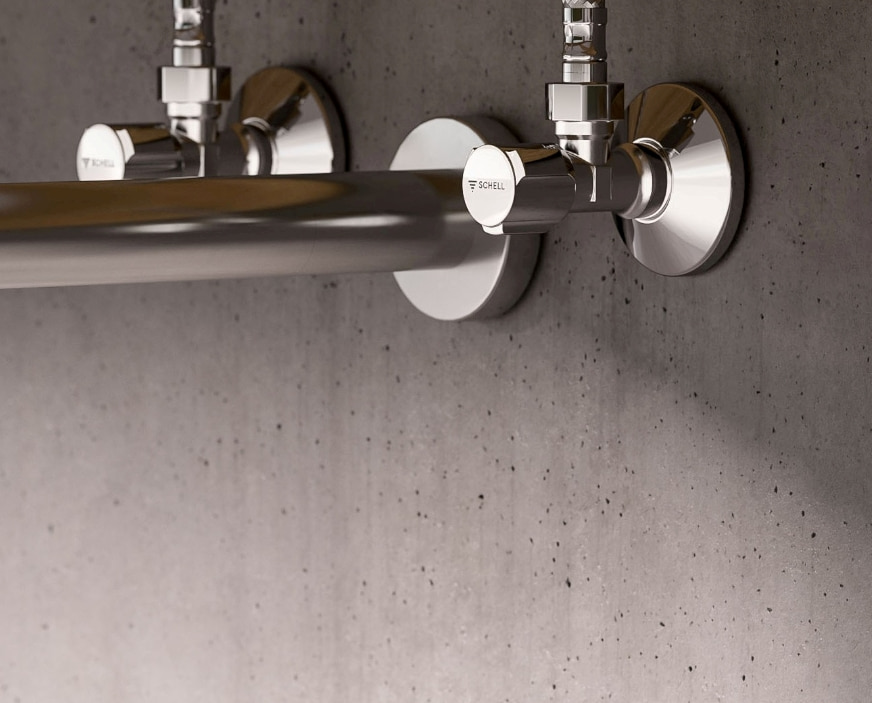 Zawory regulacyjne SCHELL Comfort w łazience na ścianie