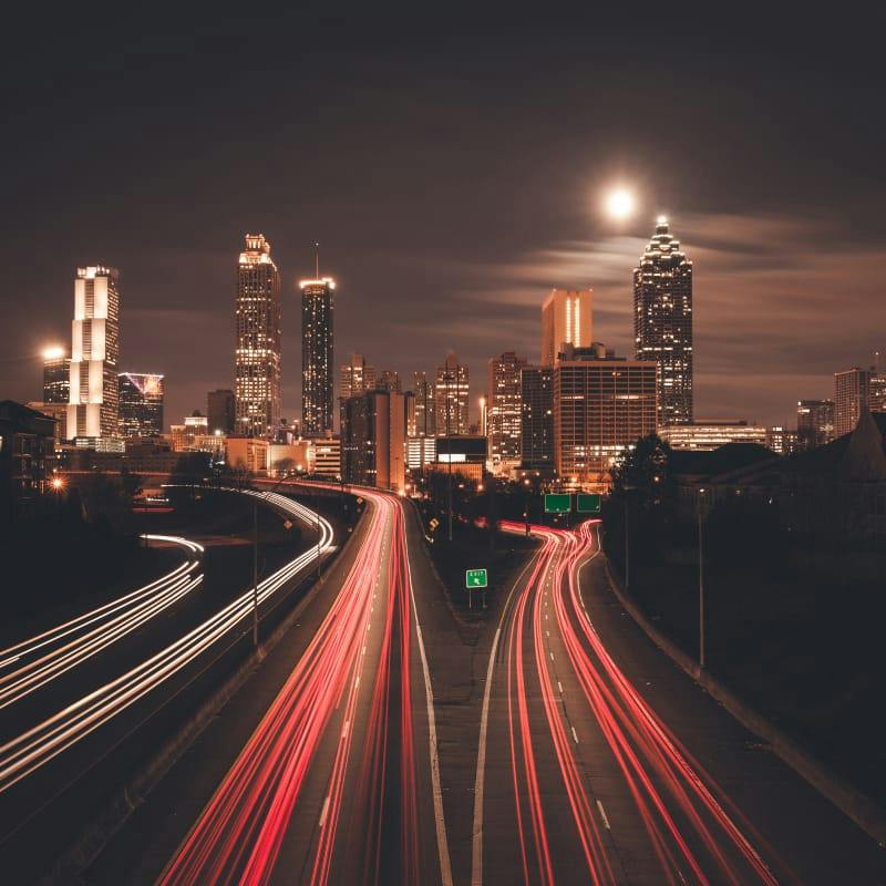 freeways with car red lights flashing by