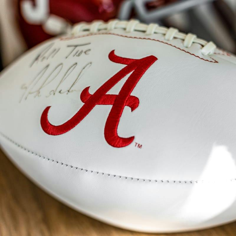 white signed football with a cursive