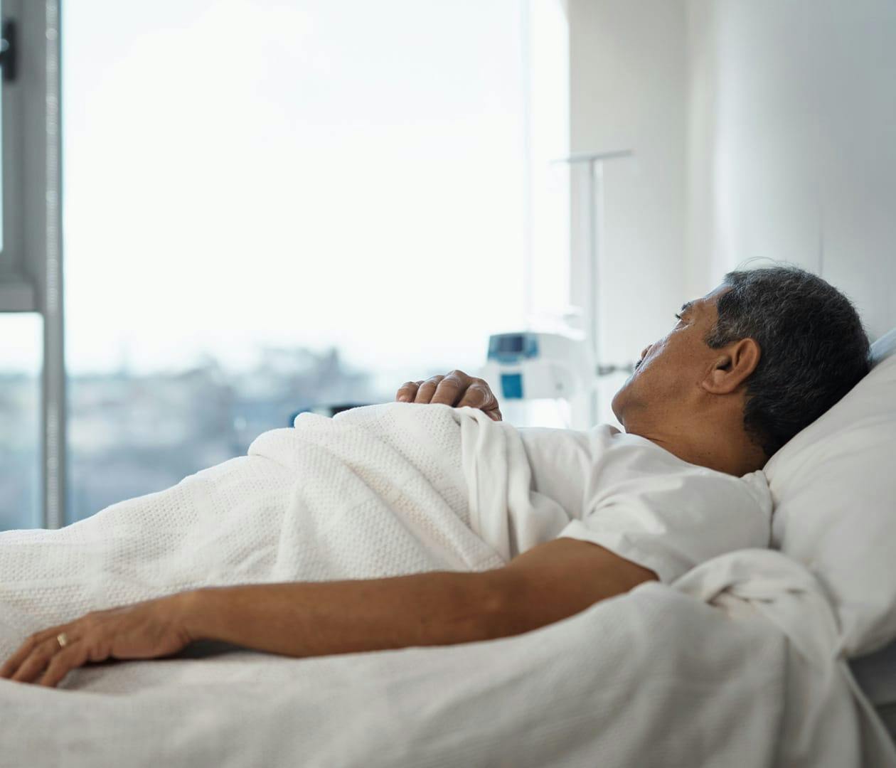 man in a hospital bed
