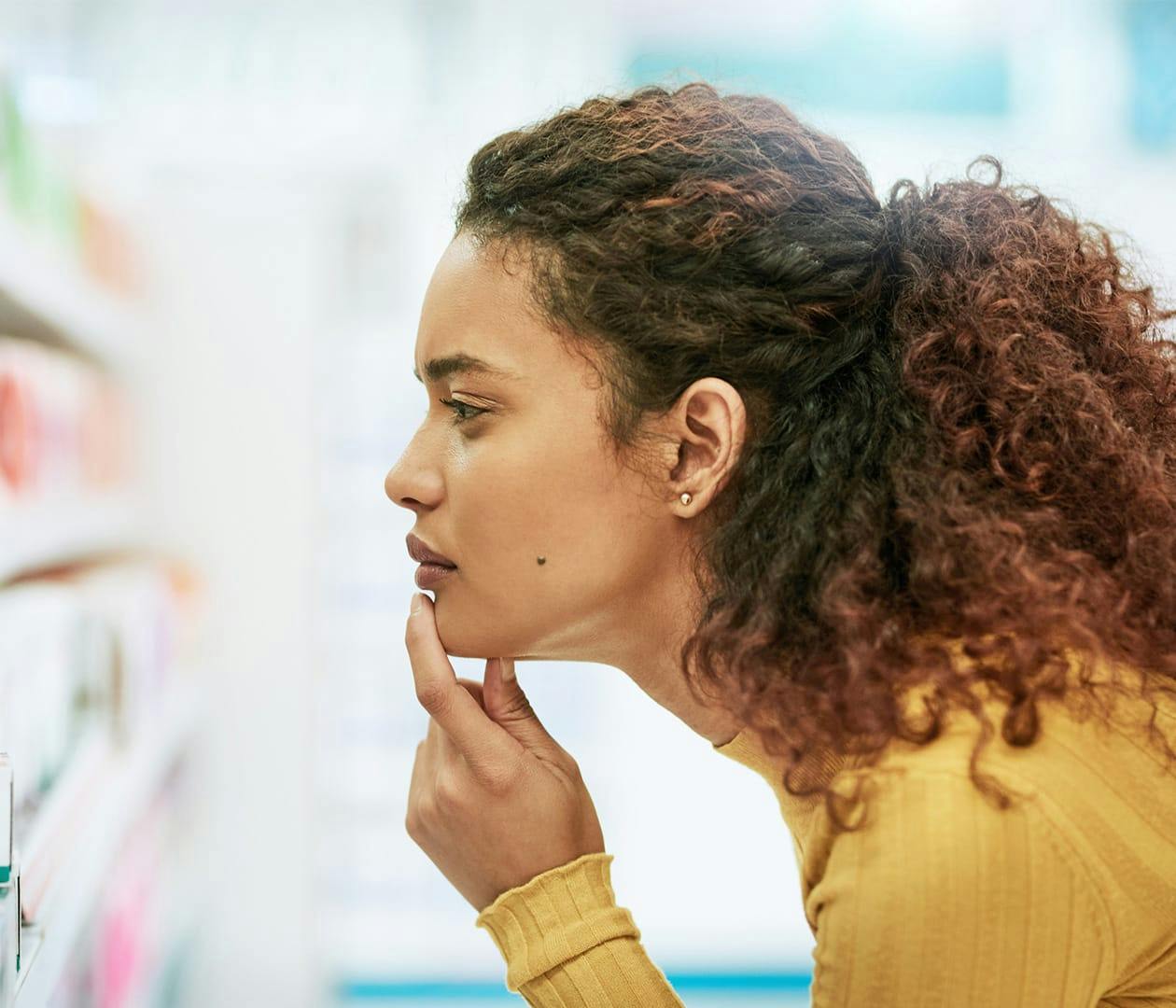 woman looking at store shelfs