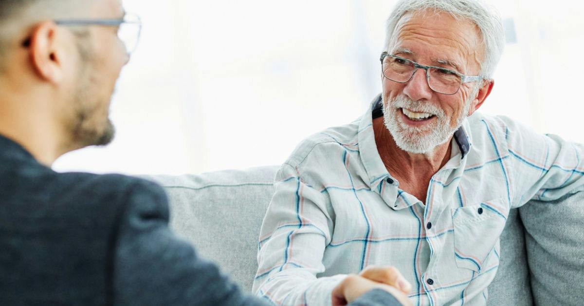 Men talking on a couch
