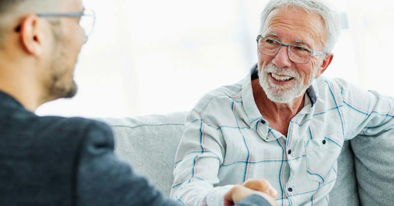 Men talking on a couch