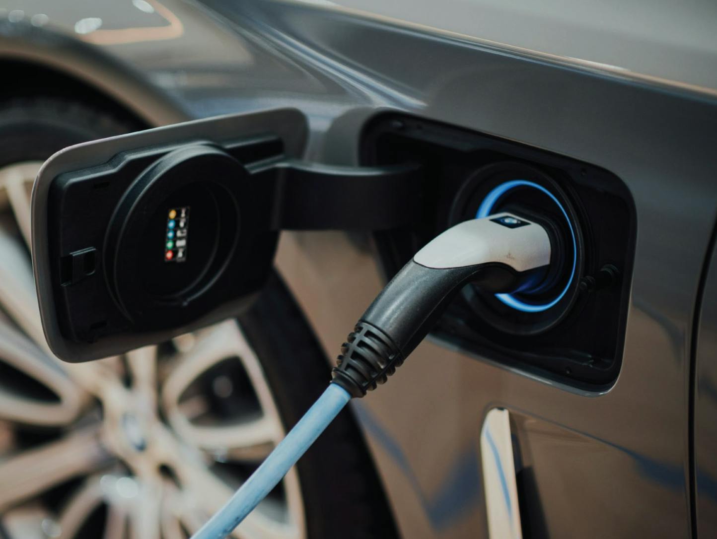 A person charging their car