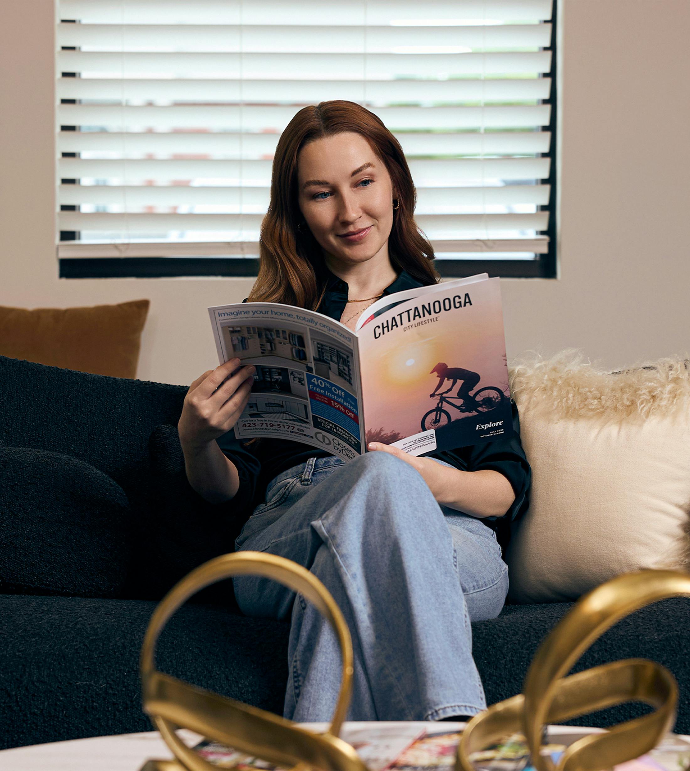woman reading a magazine
