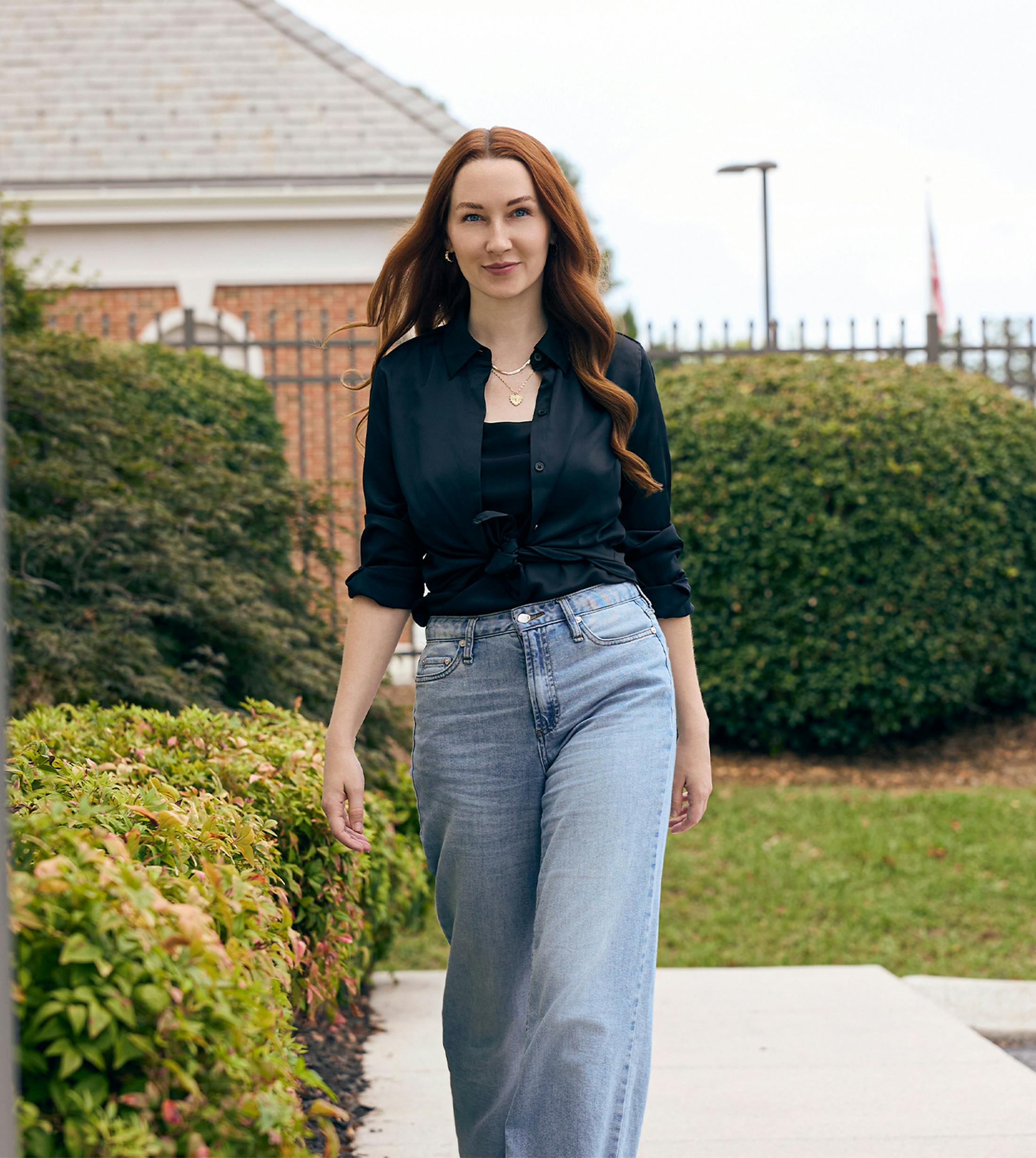 Woman walking and smiling