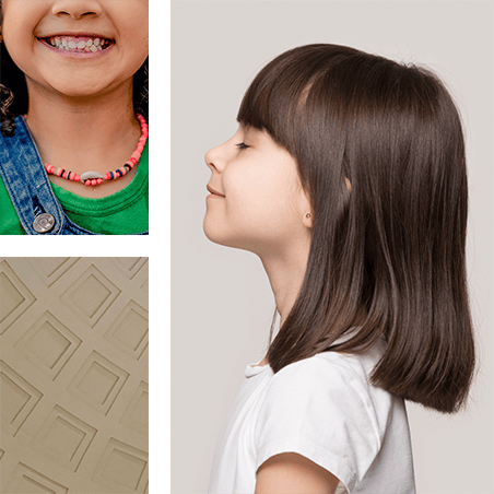 child's side profile | Child smiling | building
