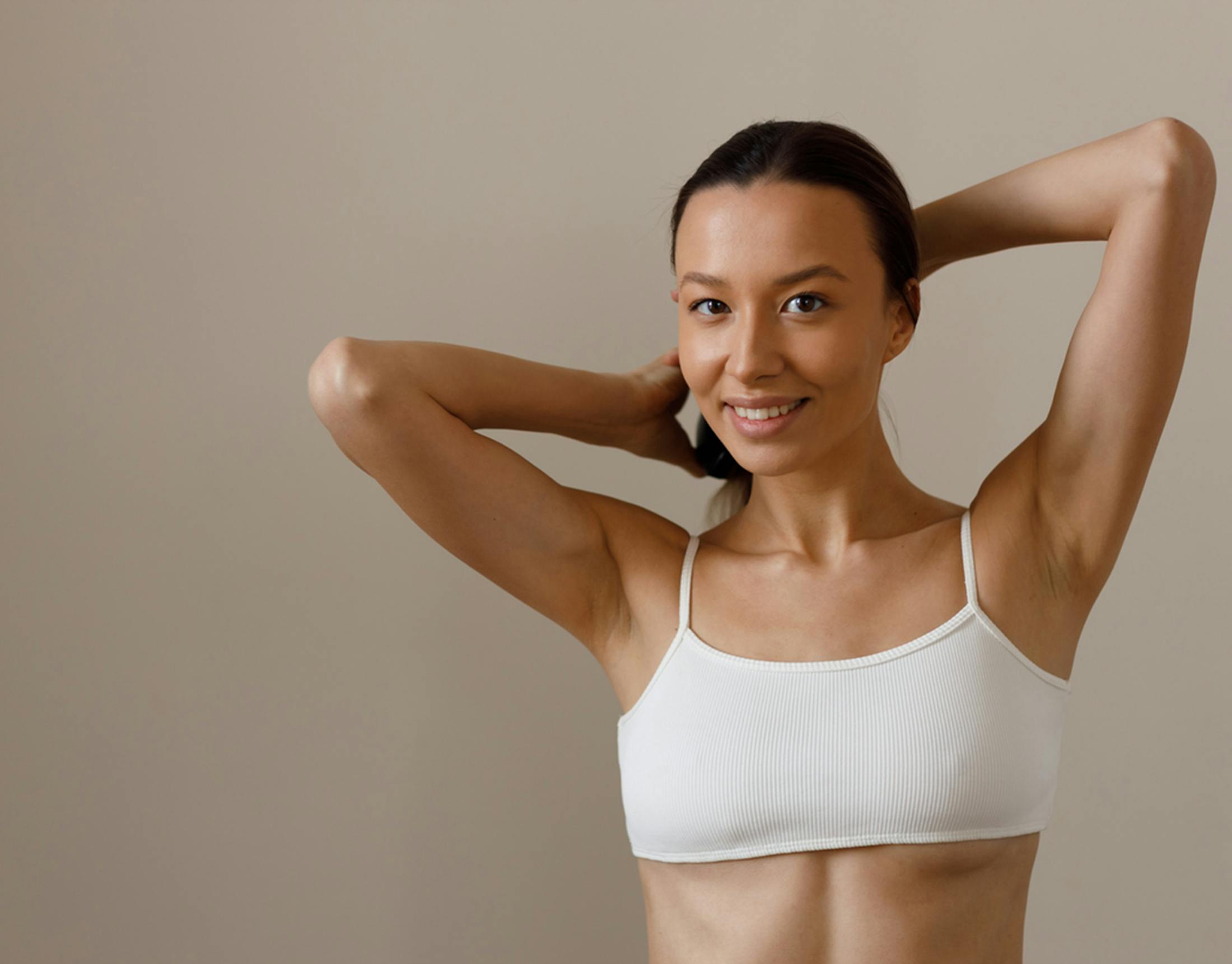 woman tying her hair back