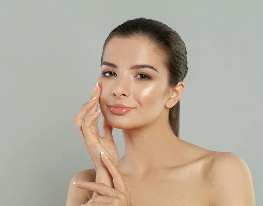 Woman touching her face