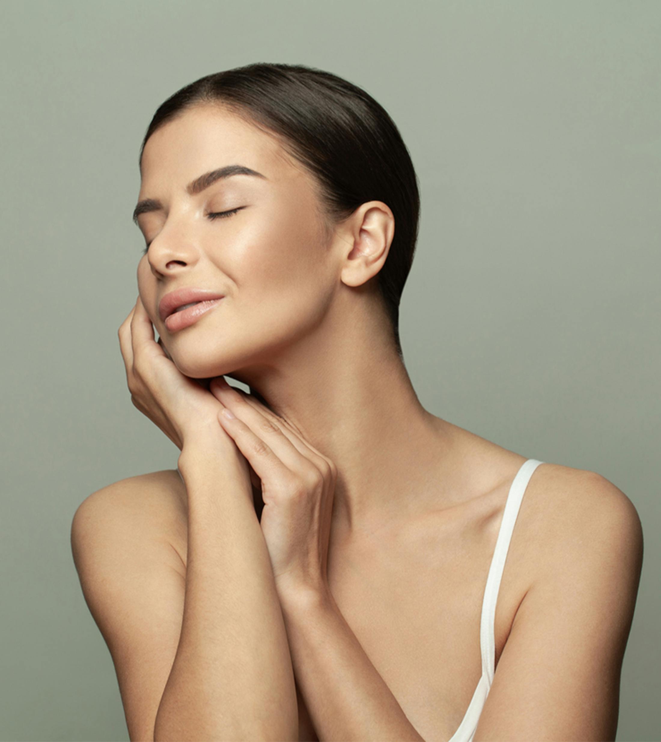 Woman touching her face
