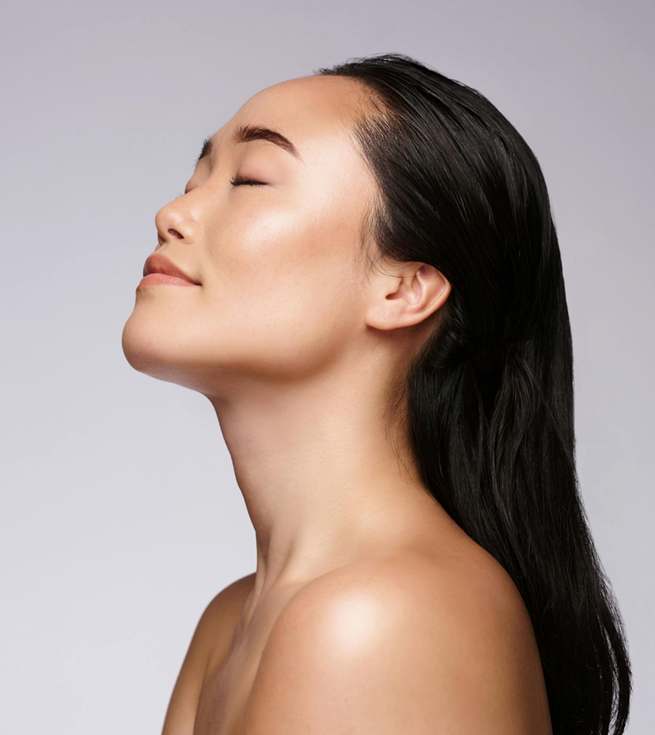 women holding her face