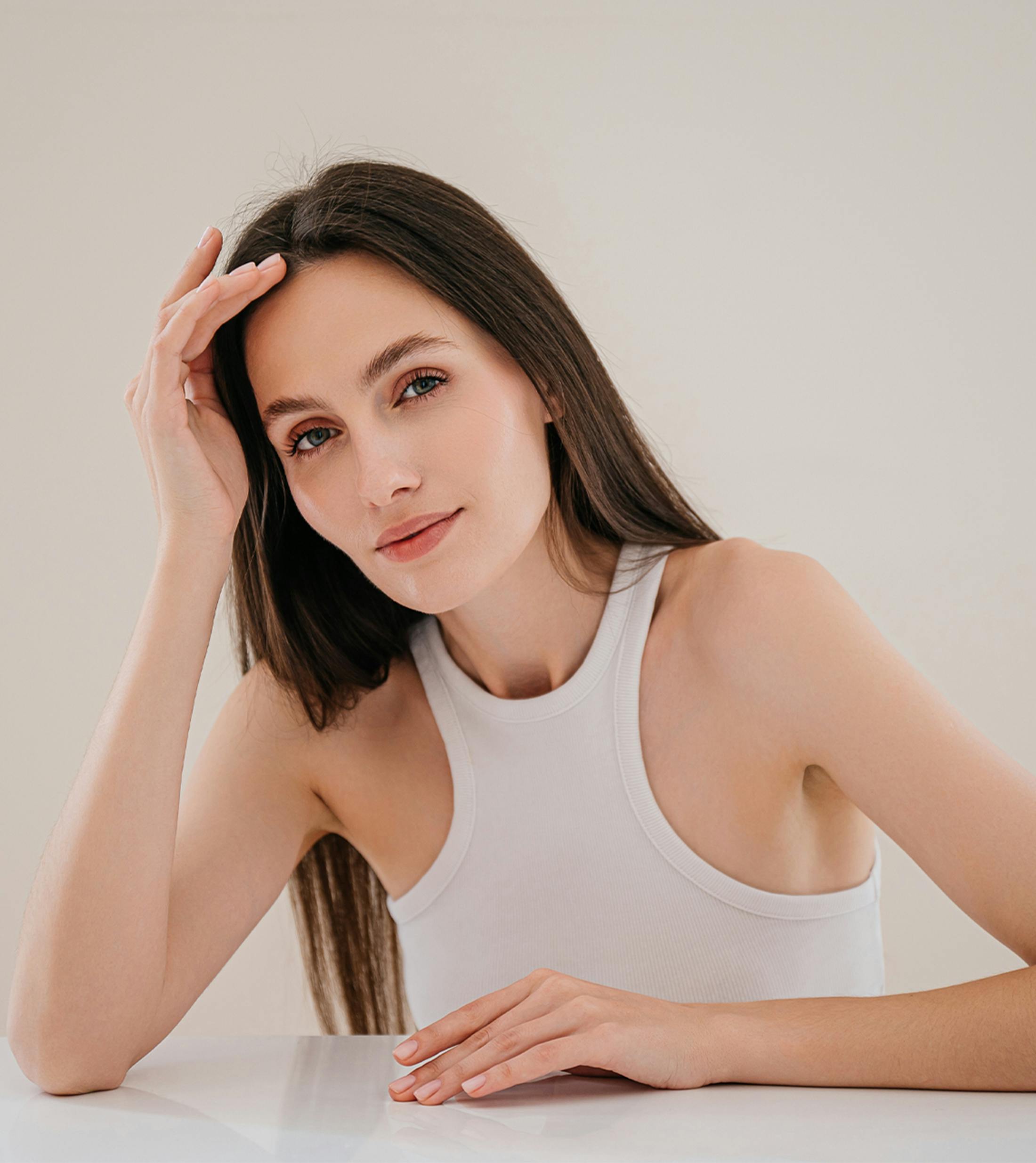 Woman touching her forehead