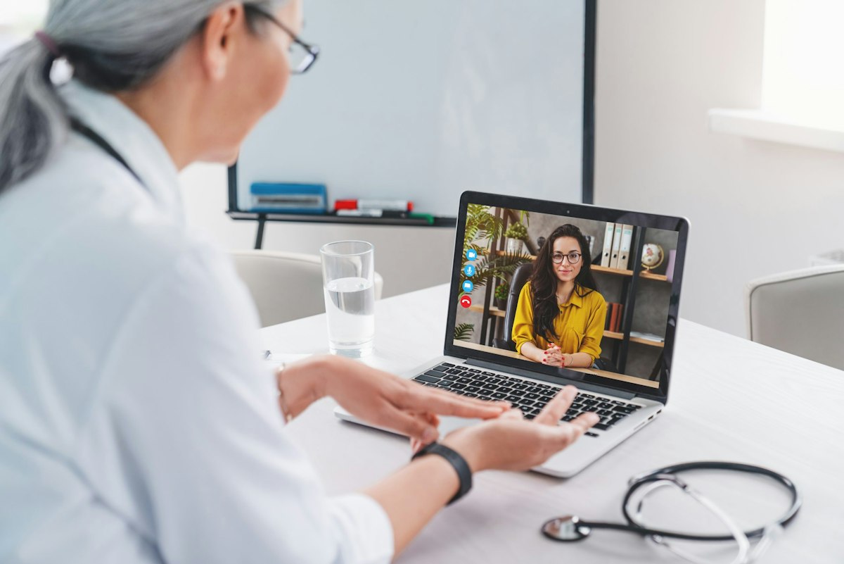 Happy patient during a telehealth visit at Geneva Med Spa speaking with Dr Jerath through secure virtual telemedicine platform