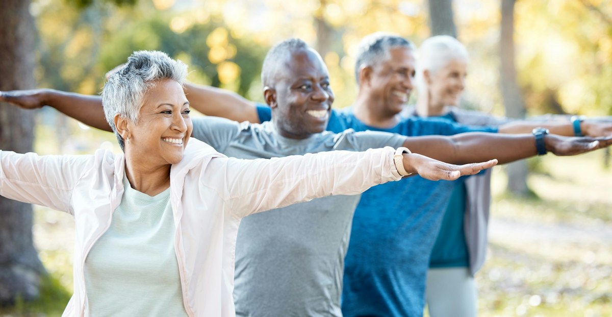 Group of older adult patients exercising outdoors after receiving physician led preventive care at Geneva Med Spa in Alpharetta