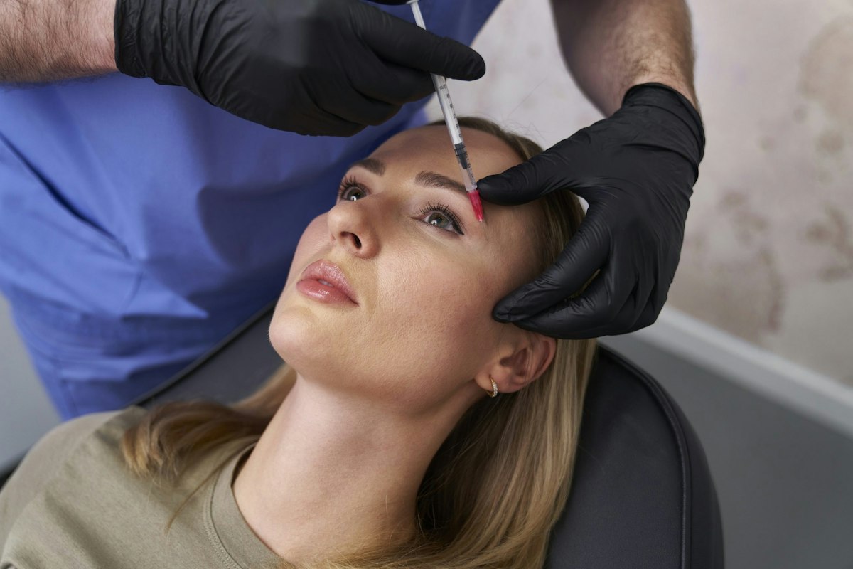 Patient receiving Botox treatment around the eye area performed by a medical provider at Geneva Primary Care and Med Spa in Alpharetta