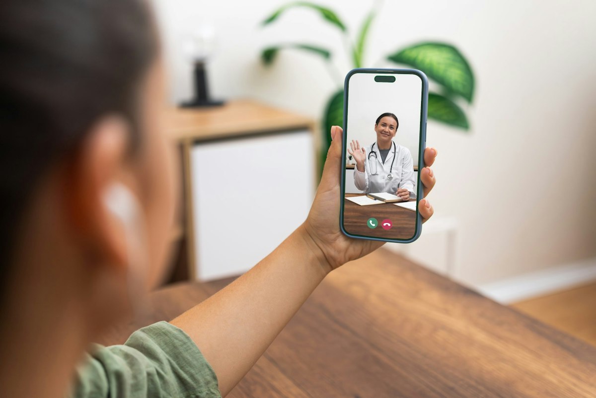 A female Geneva physician greeting a patient through a telemedicine video call as part of the clinic’s virtual care services.