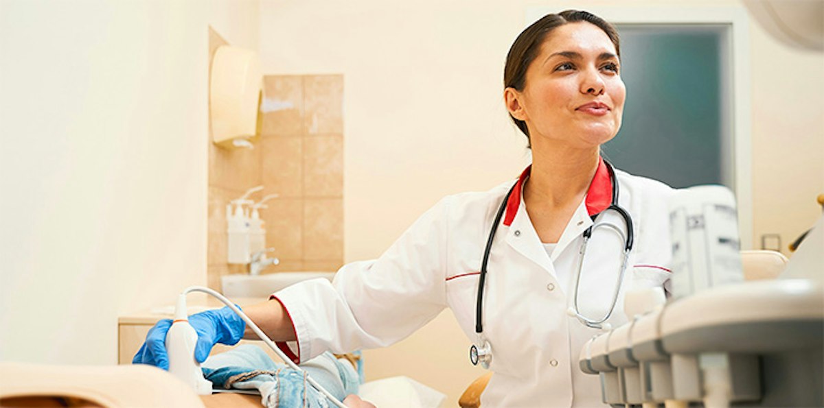 A female physician at Geneva performing diagnostic testing and evaluations focused on women’s health in a calm clinical setting.