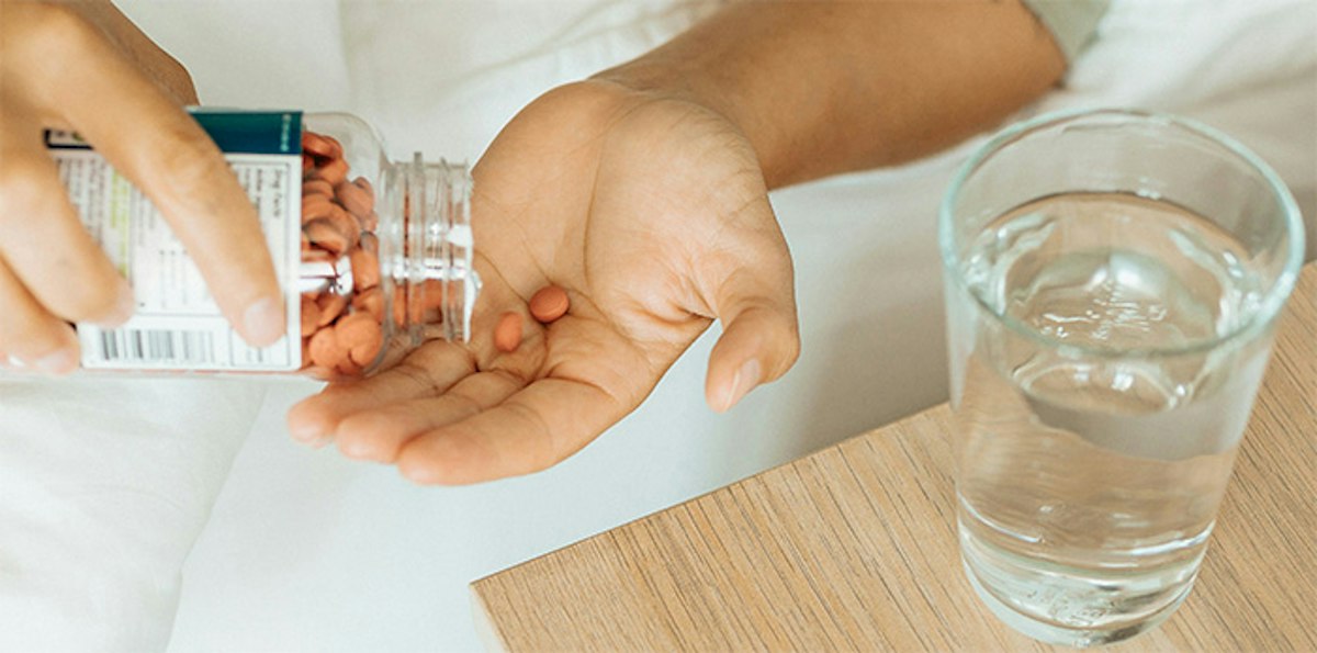 A patient taking daily supplements recommended as part of a personalized preventative care plan at Geneva.