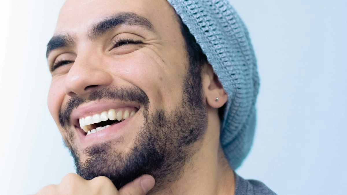 Patient smiling after peptide therapy results at Geneva Med Alpharetta, experiencing improved metabolic health and confi