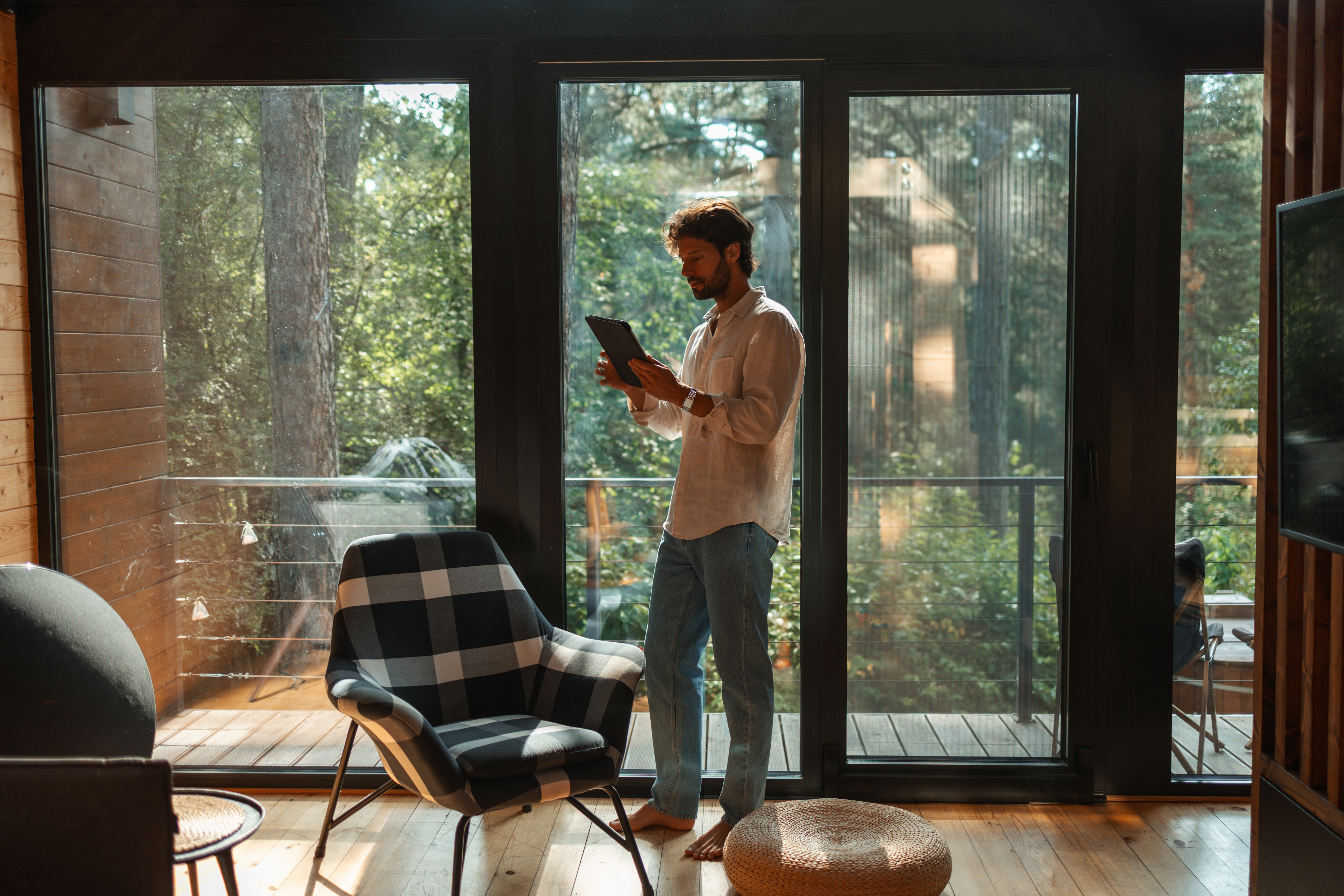Host stood in property using a tablet device