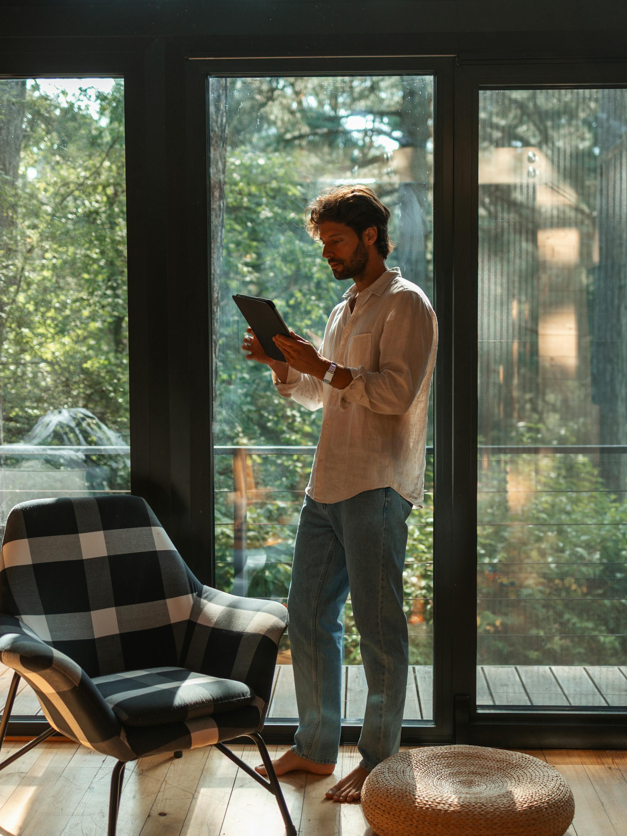 Host stood in property using a tablet device
