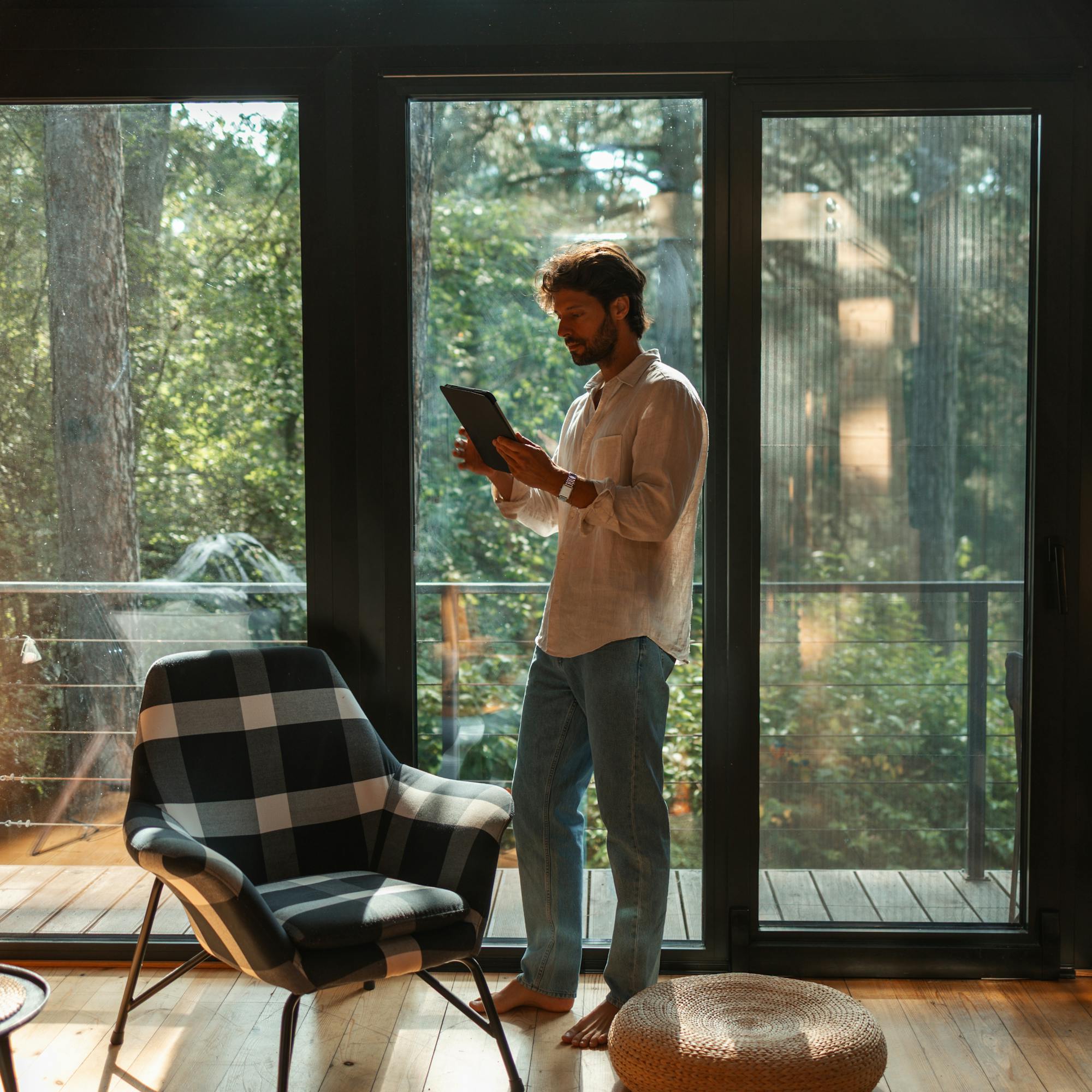 Host stood in property using a tablet device
