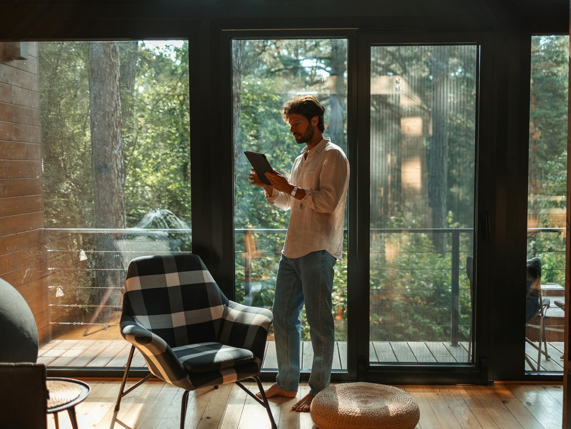Host stood in property using a tablet device