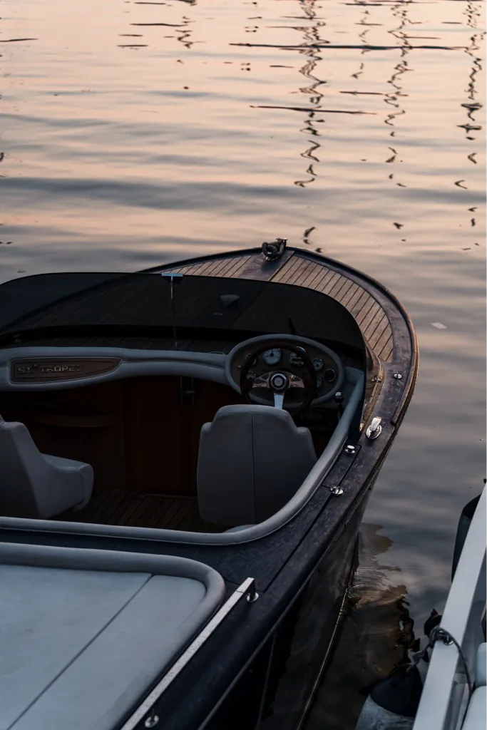 Boat berthed on calm water at sunset