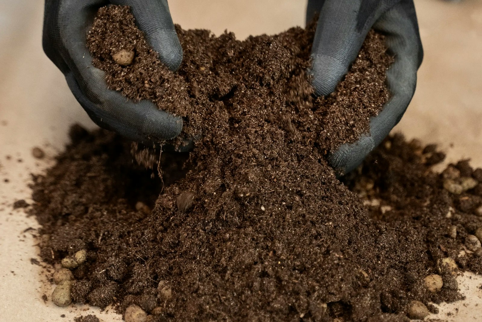 Hands sifting soil