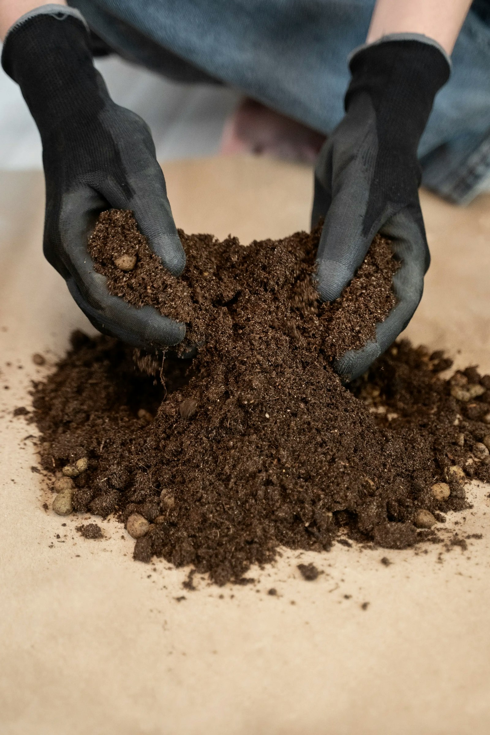 Hands sifting soil