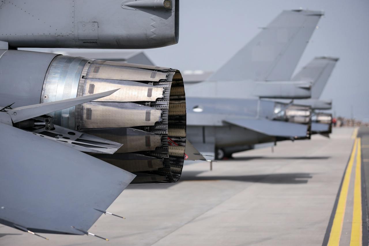 Close-up of a fighter jet engine nozzle on the tarmac