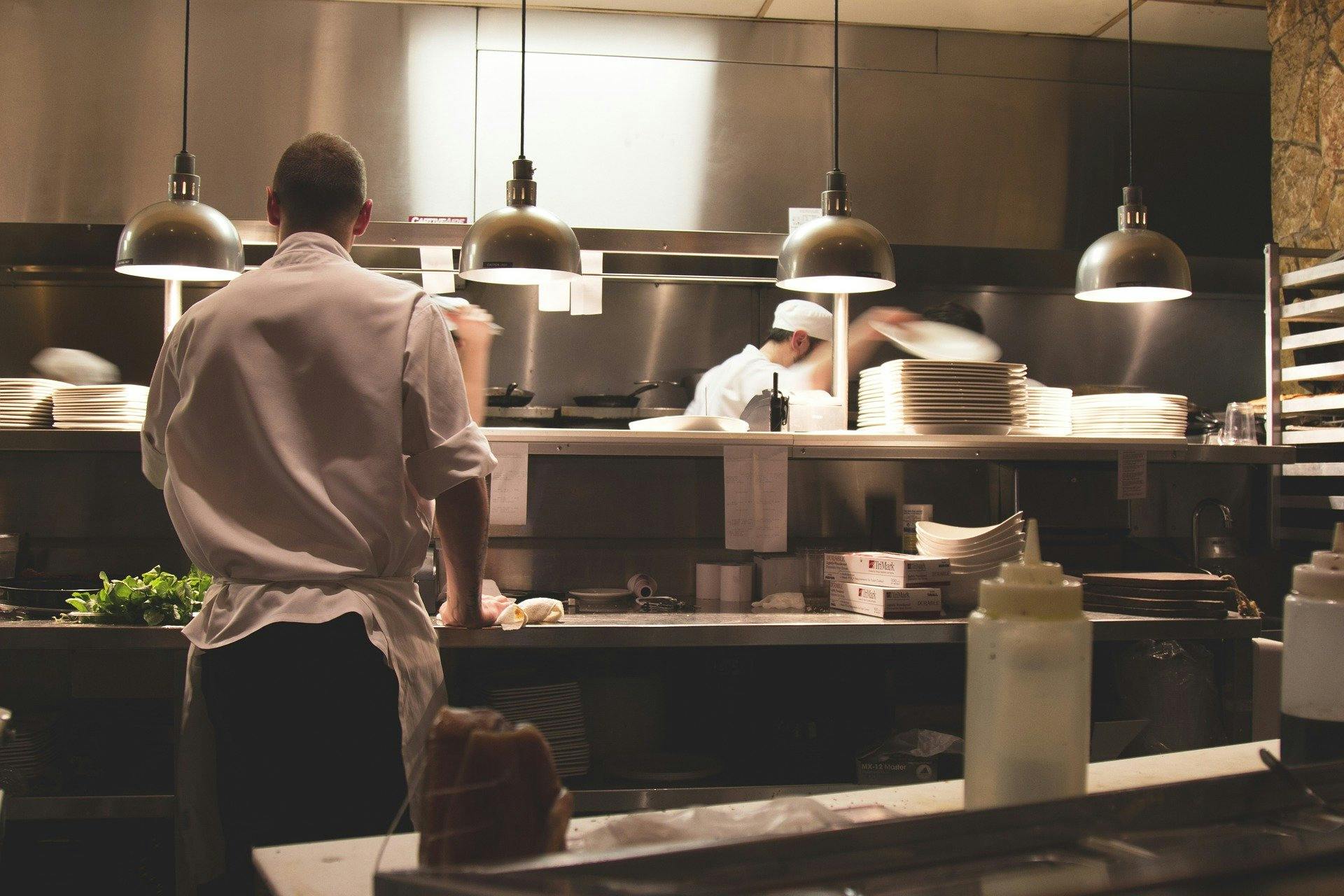 chefs and waiters working in a restaurant