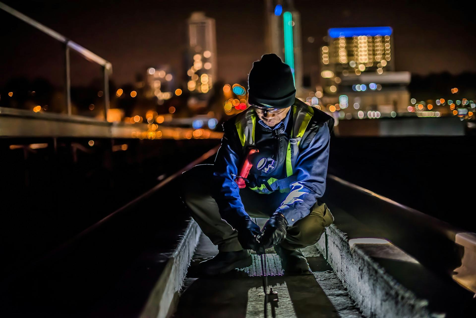 male working in city at night