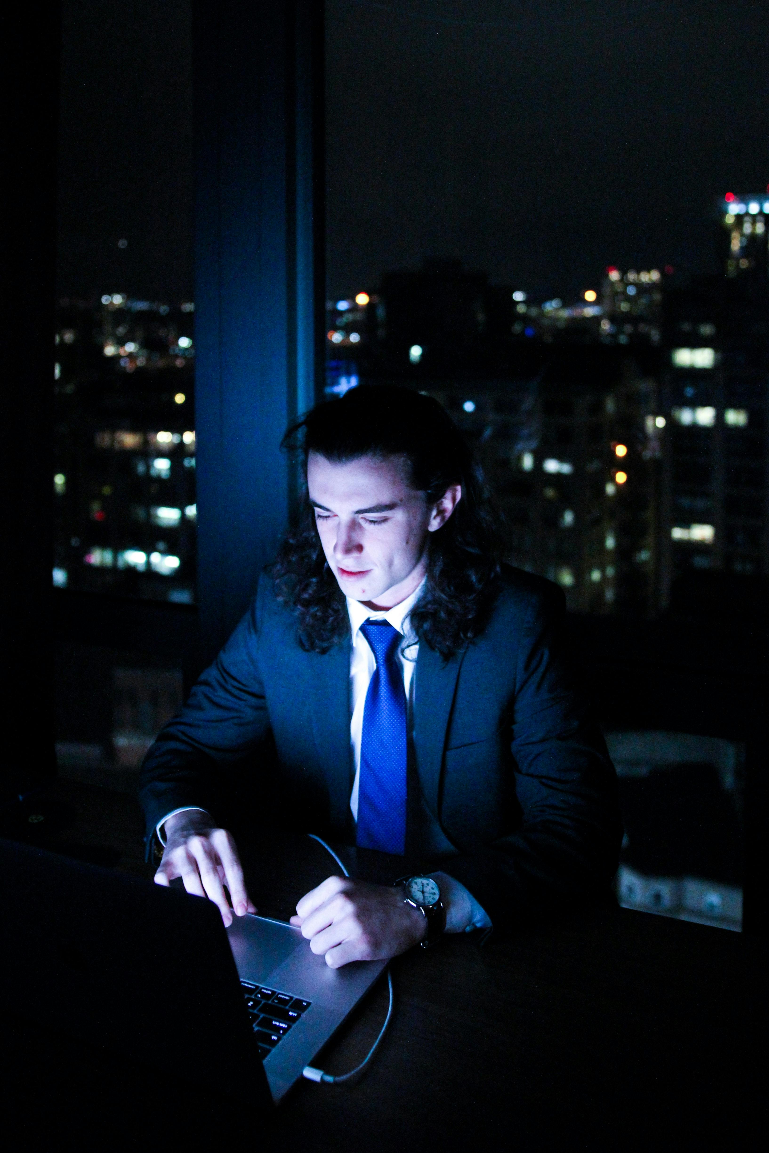 business man working at night on laptop