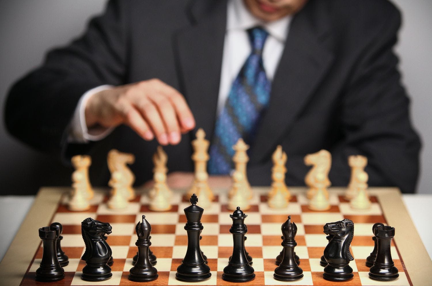 business man playing chess