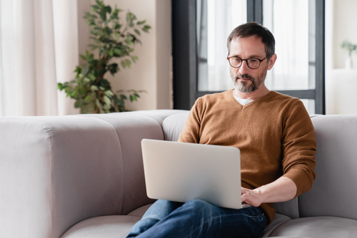 an employee working on their laptop from home