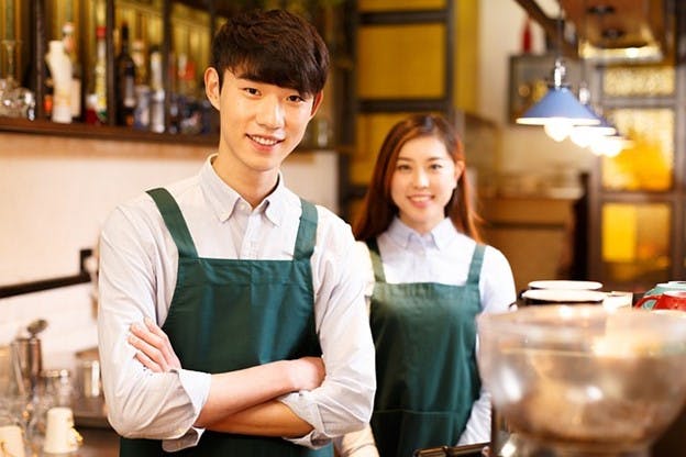 Employees of different genders working together Employees of different genders working together
